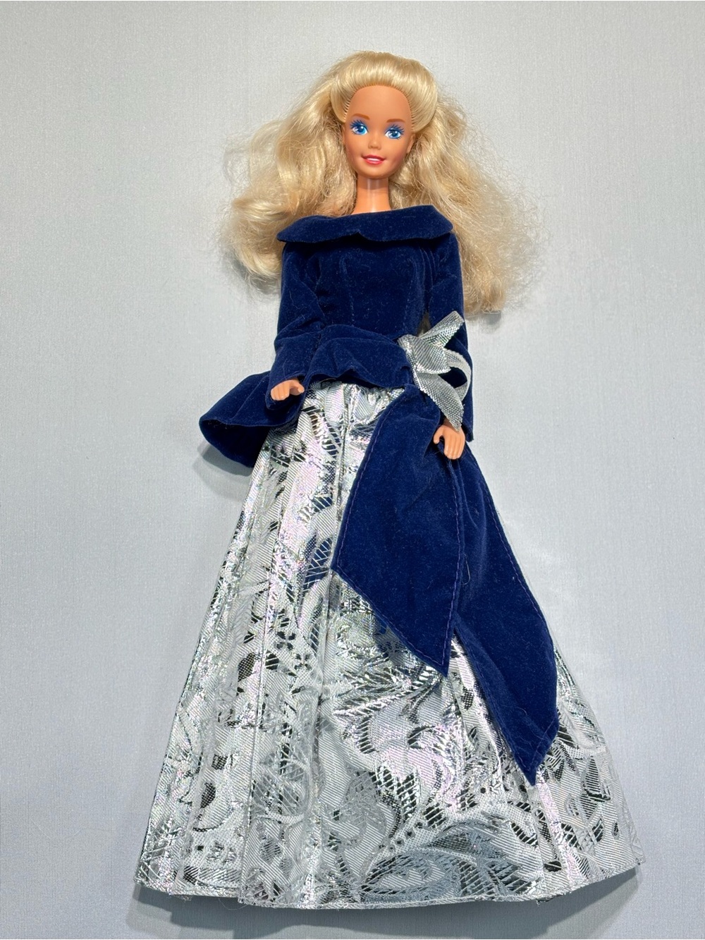 1990s Barbie doll in a 1995 Avon Special Edition Winter Velvet Barbie Doll dress